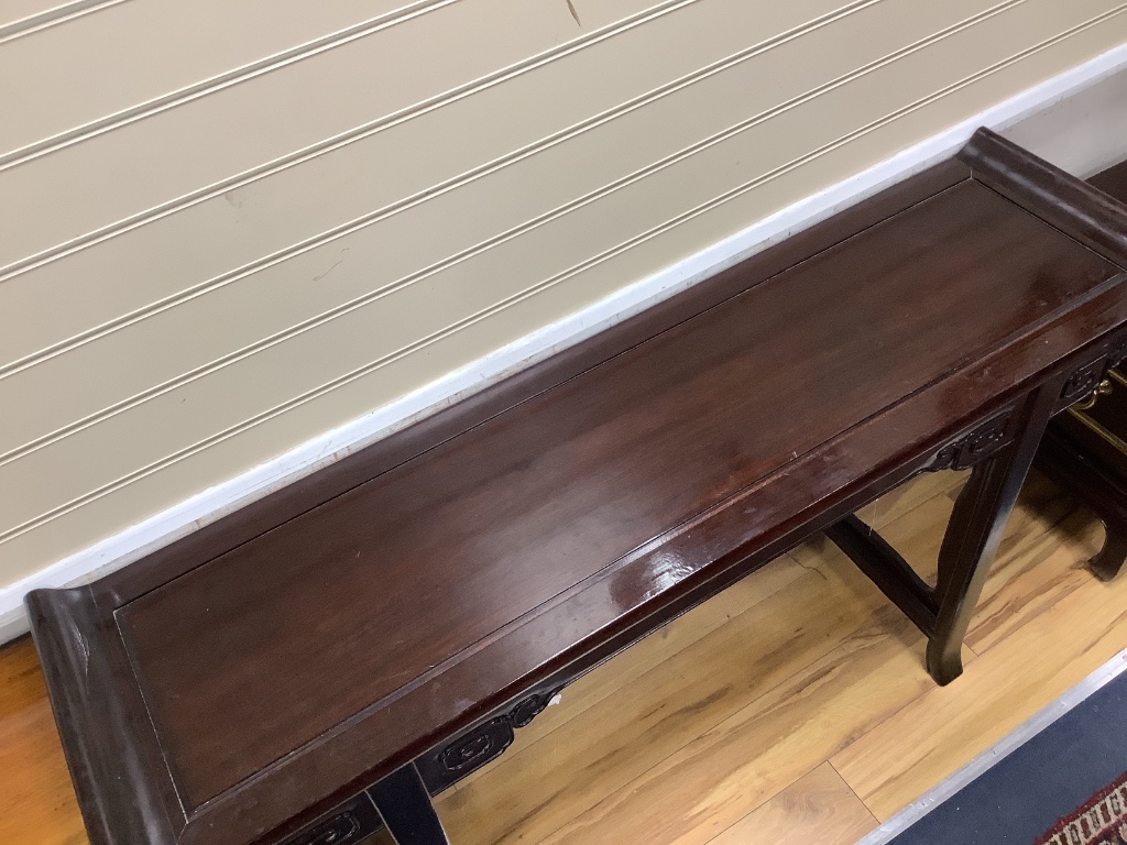 A 20th century Chinese hardwood altar table, width 150cm depth 40cm height 86cm